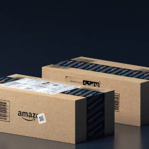 Two Amazon delivery boxes displayed against a dark background